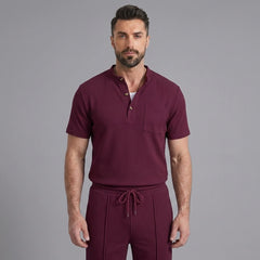 Man wearing a claret waffle stand collar button up shirt and drawstring shorts front view