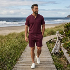 Man wearing claret waffle stand collar shirt and drawstring shorts in outdoor lifestyle setting