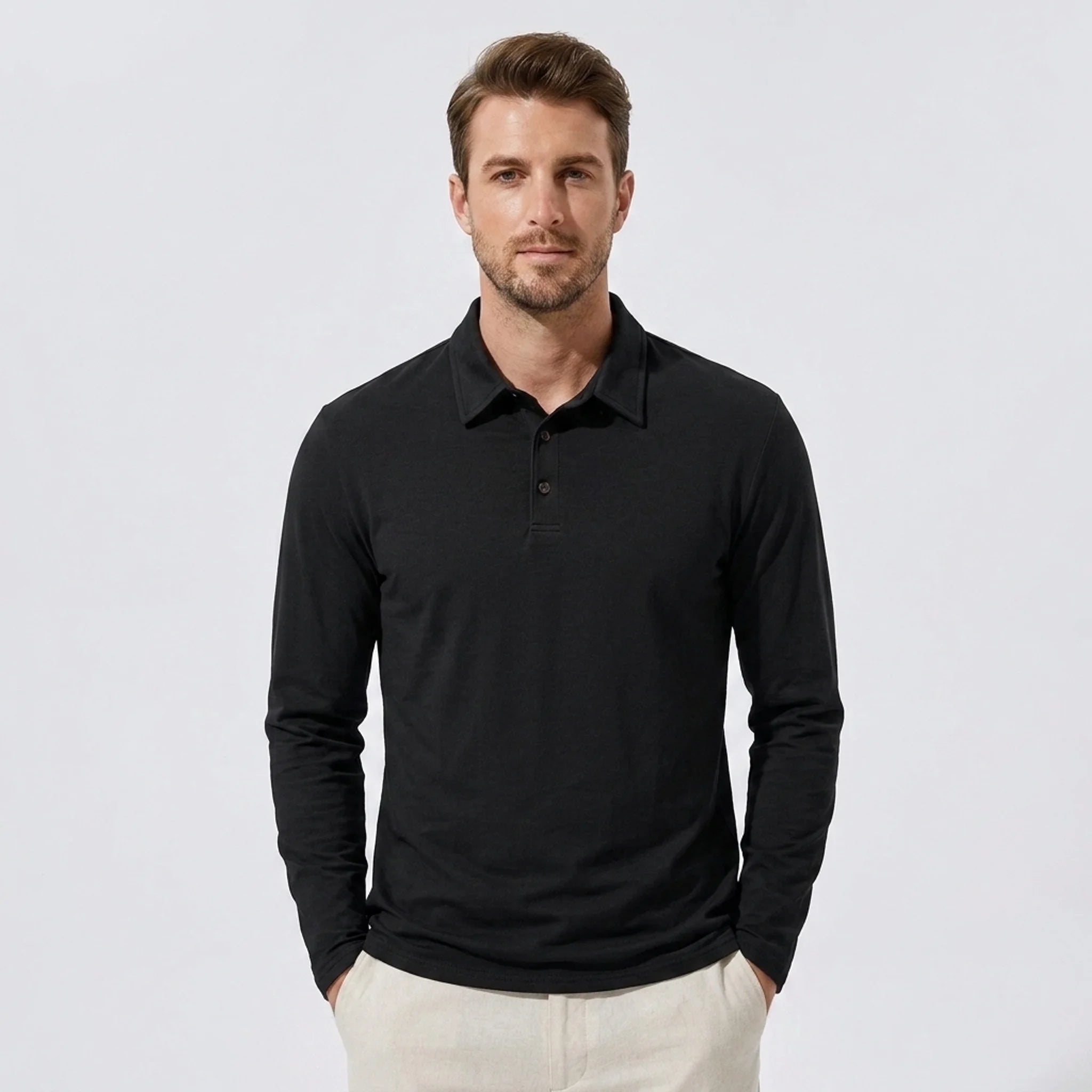 Man wearing a coffee solid long sleeve cotton polo shirt front view on plain background