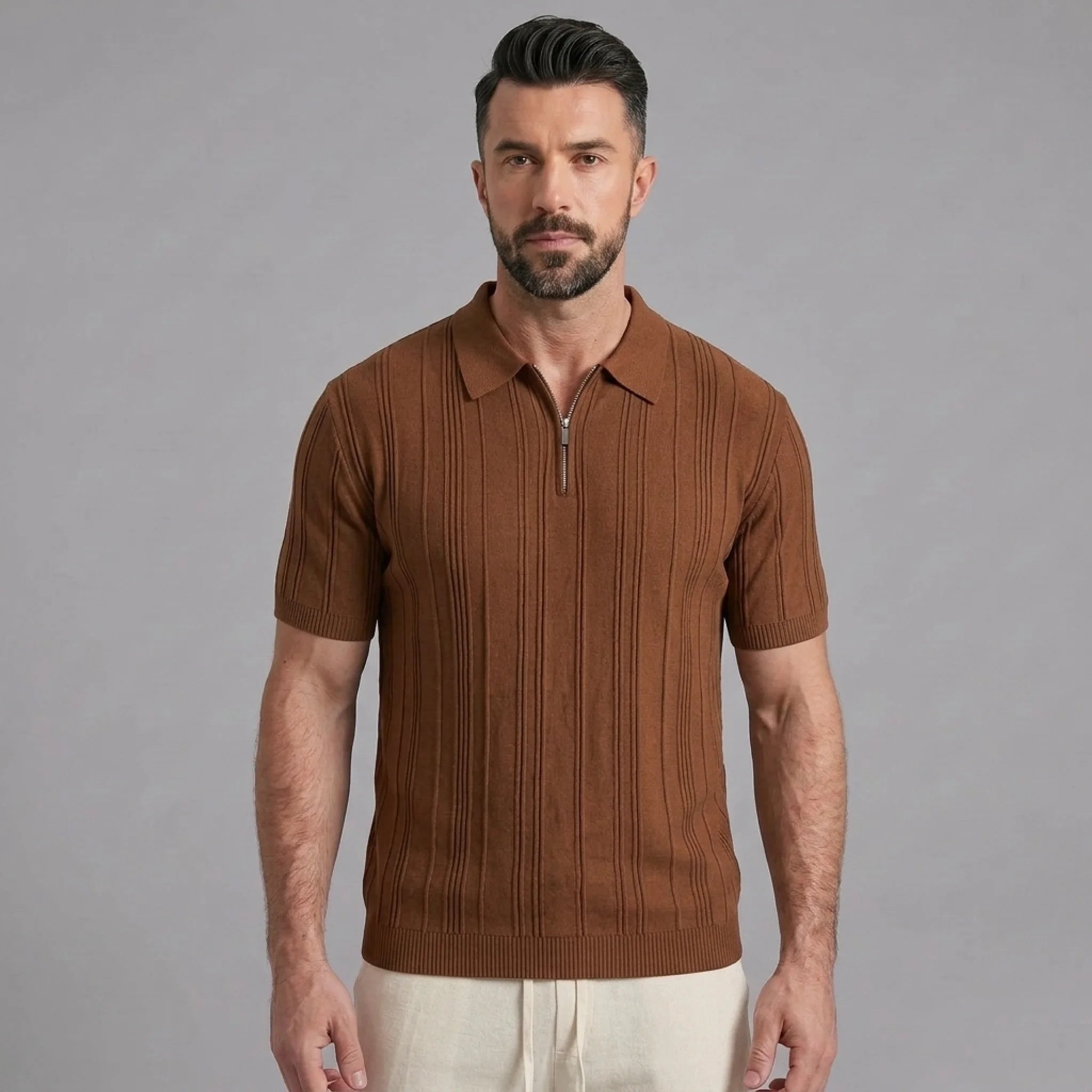 Man wearing a coffee stripe jacquard knit zip-up polo shirt front view on plain background