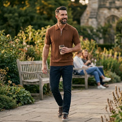 Man wearing coffee stripe jacquard knit zip-up polo shirt in outdoor lifestyle setting