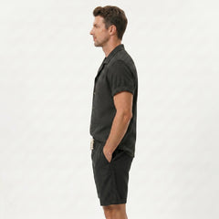 Back view of man wearing coffee brown textured Cuban shirt and linen cotton drawstring shorts