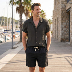 Man wearing coffee brown textured Cuban shirt and linen drawstring shorts in outdoor lifestyle setting