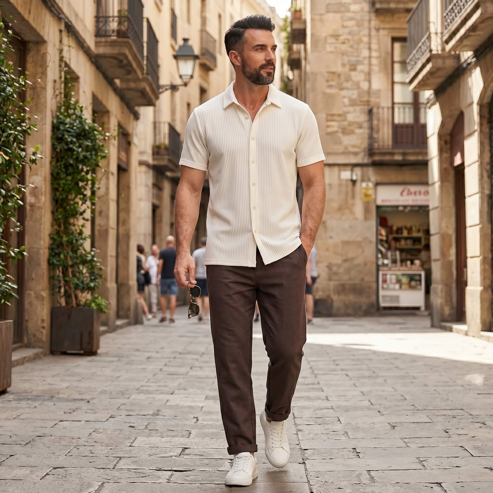 Man wearing coffee brown waffle button up shirt and linen pants in outdoor lifestyle setting