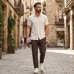 Man wearing coffee brown waffle button up shirt and linen pants in outdoor lifestyle setting