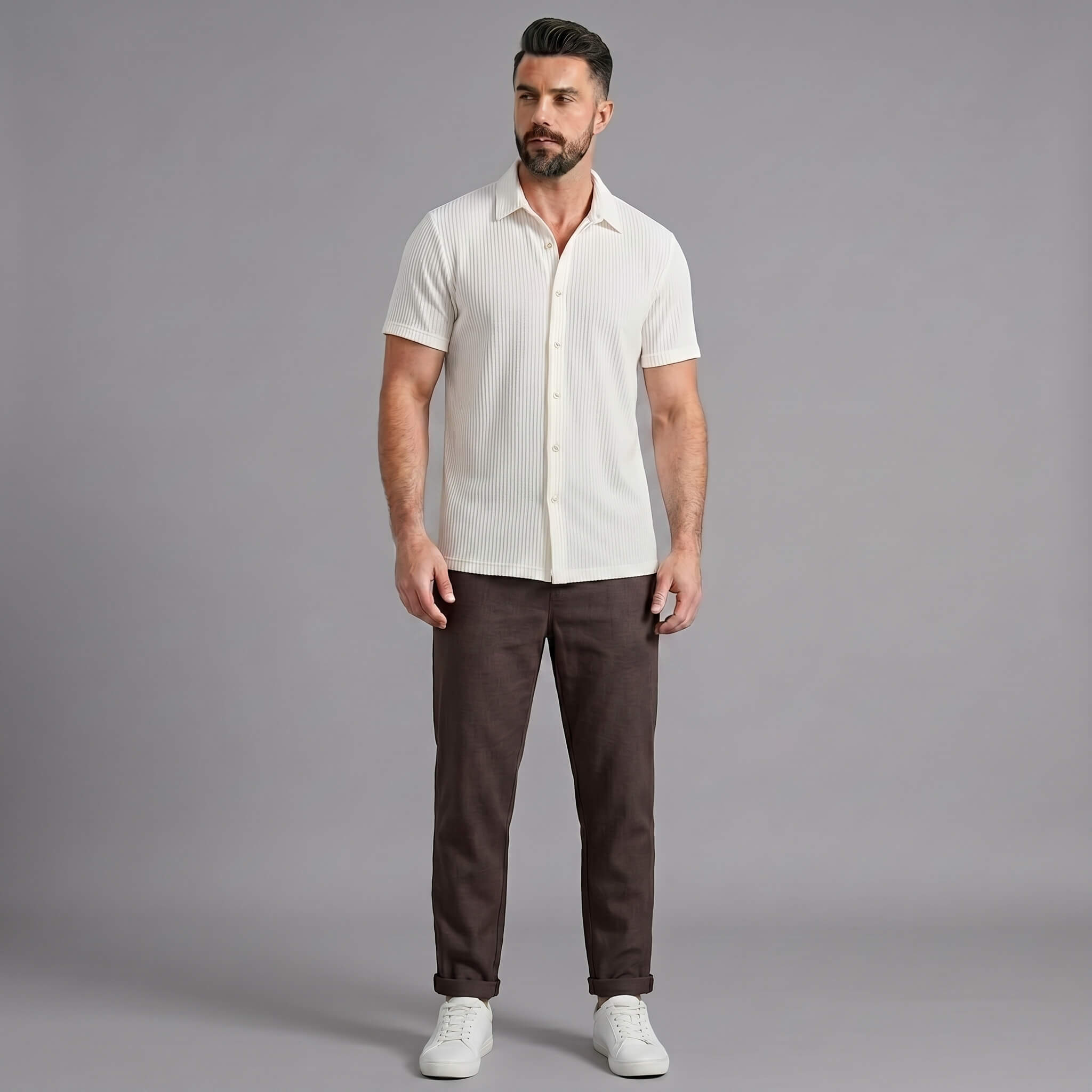 Man wearing a coffee brown waffle button up shirt and straight leg linen pants front view