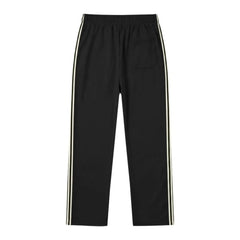 MannerCo black color-block drawstring jogger pants product display with contrast tape detail