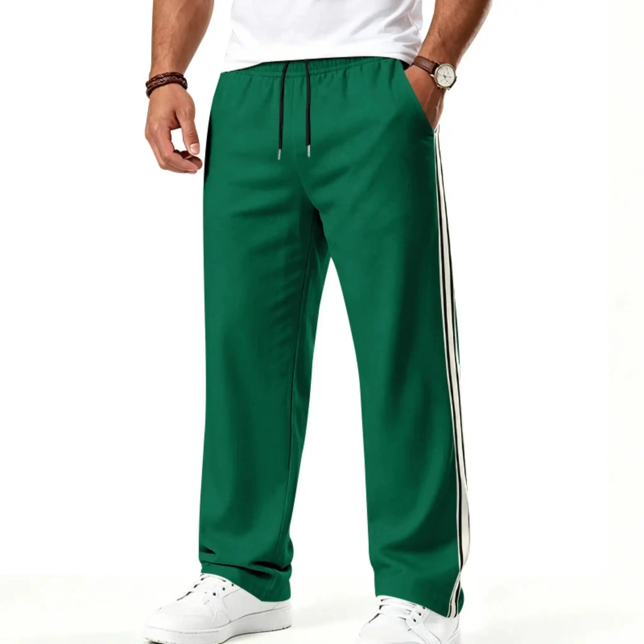 Man wearing MannerCo grass green color-block drawstring jogger pants, side view on plain background