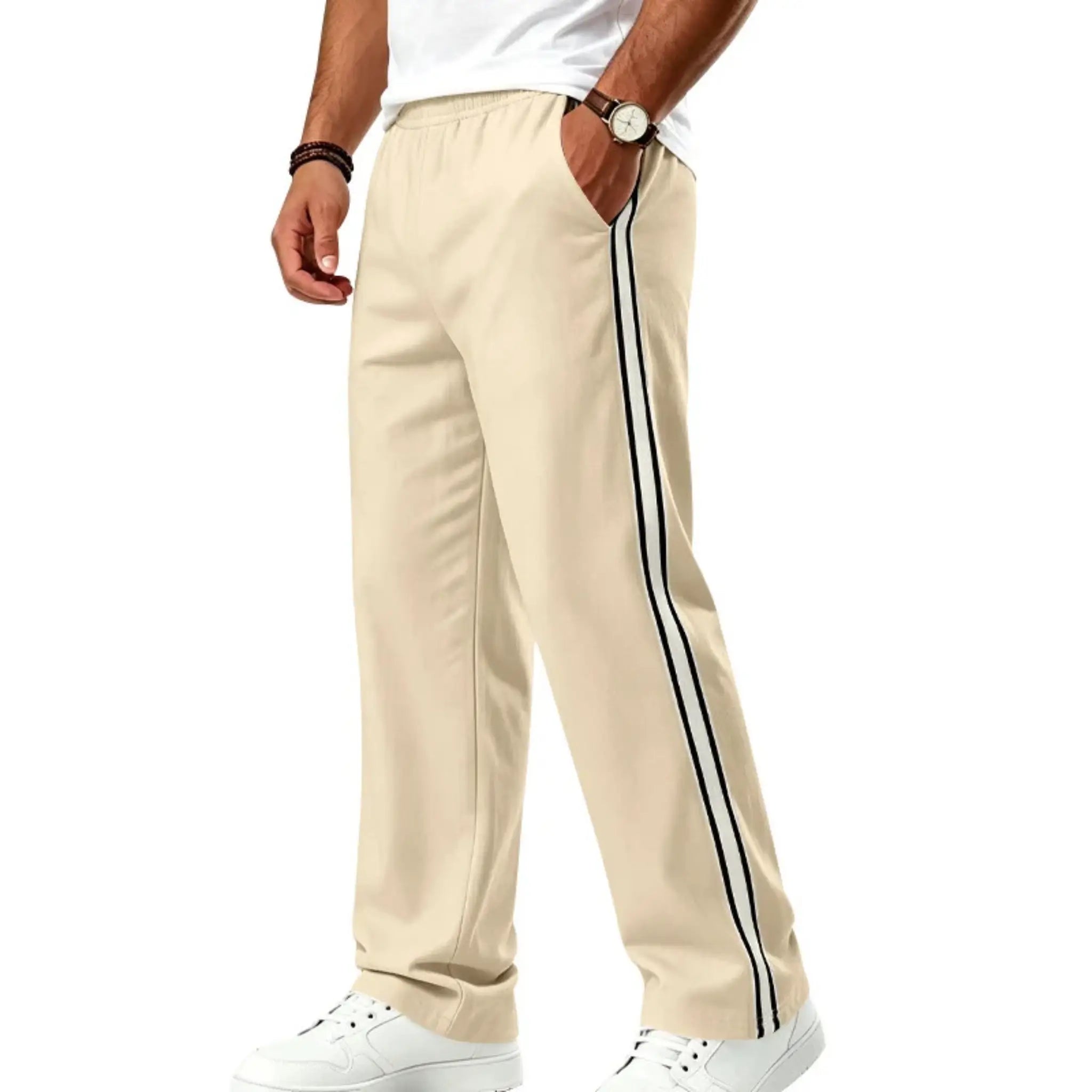 Man wearing MannerCo khaki color-block drawstring jogger pants with contrast tape detail, front view