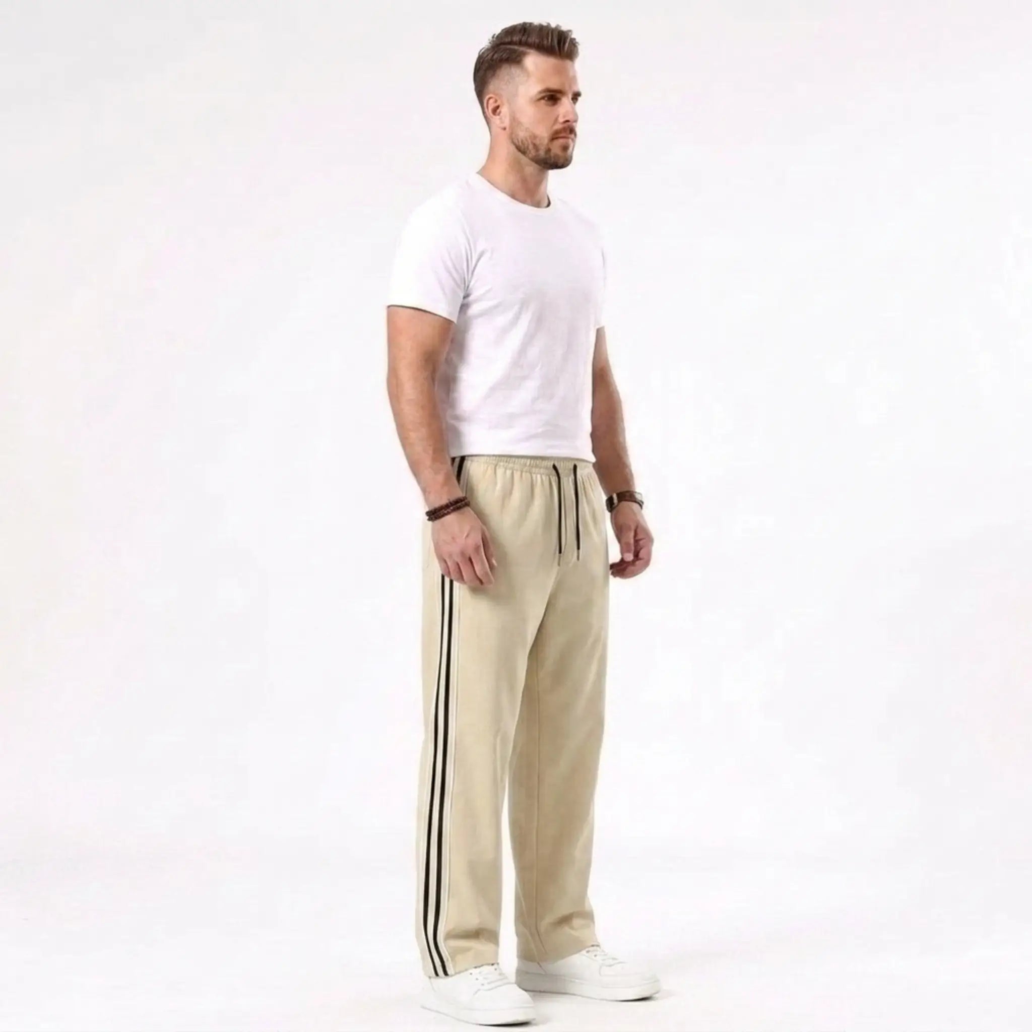 Man wearing MannerCo khaki color-block drawstring jogger pants in outdoor lifestyle setting