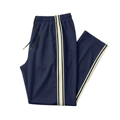 MannerCo navy blue color-block jogger pants product display with contrast tape side stripe
