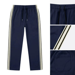 MannerCo navy blue drawstring jogger pants with color-block contrast tape detail, product display