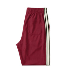 MannerCo wine red color-block drawstring jogger pants product display with tape side detail