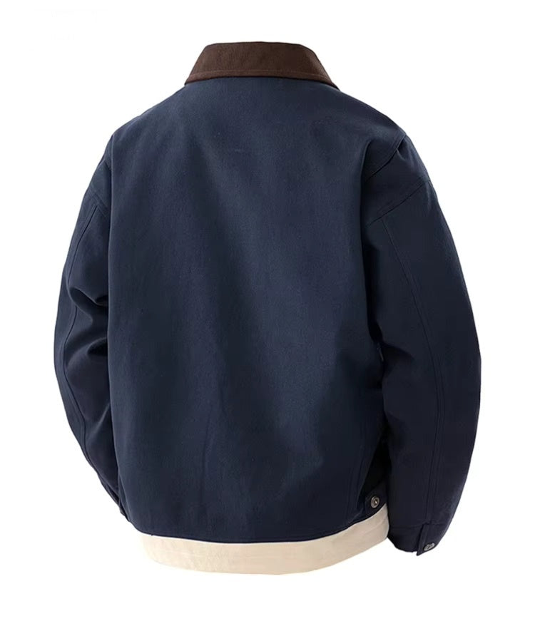 Man wearing MannerCo blue contrast lapel workwear jacket with turn-down collar, front view