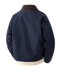 Man wearing MannerCo blue contrast lapel workwear jacket with turn-down collar, front view