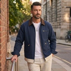 Man wearing MannerCo blue contrast lapel workwear jacket in outdoor lifestyle setting