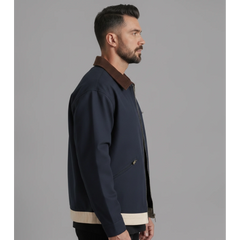 Man wearing MannerCo blue contrast lapel workwear jacket, side view on plain background