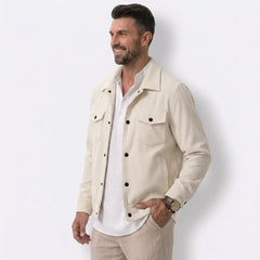 Man wearing MannerCo apricot corduroy single-breasted lapel jacket, side view on plain background