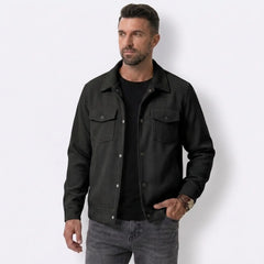 Man wearing MannerCo black corduroy lapel jacket, back view on plain background