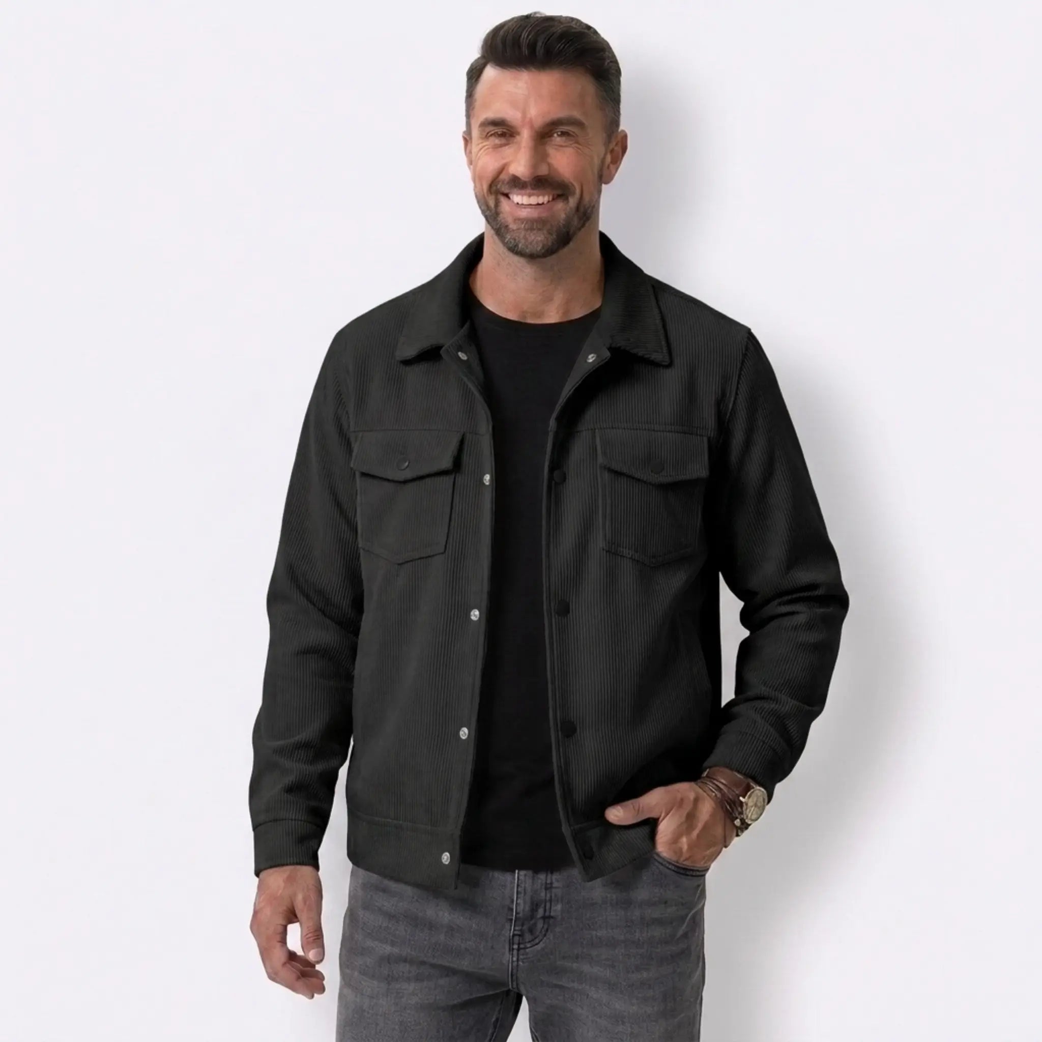 Man wearing MannerCo black corduroy lapel jacket, front view on plain background
