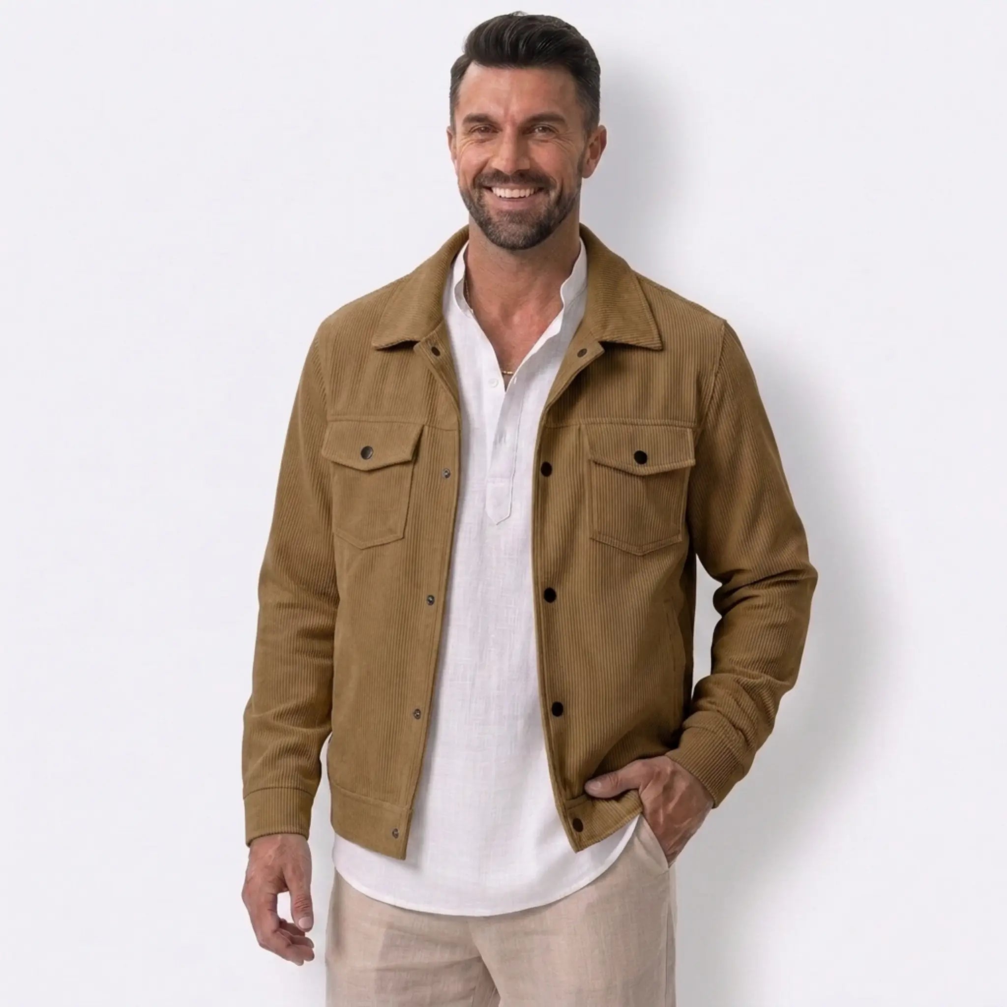 Man wearing MannerCo black corduroy single-breasted lapel jacket, front view on plain background
