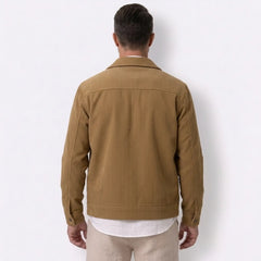 Man wearing MannerCo black corduroy lapel jacket in outdoor lifestyle setting