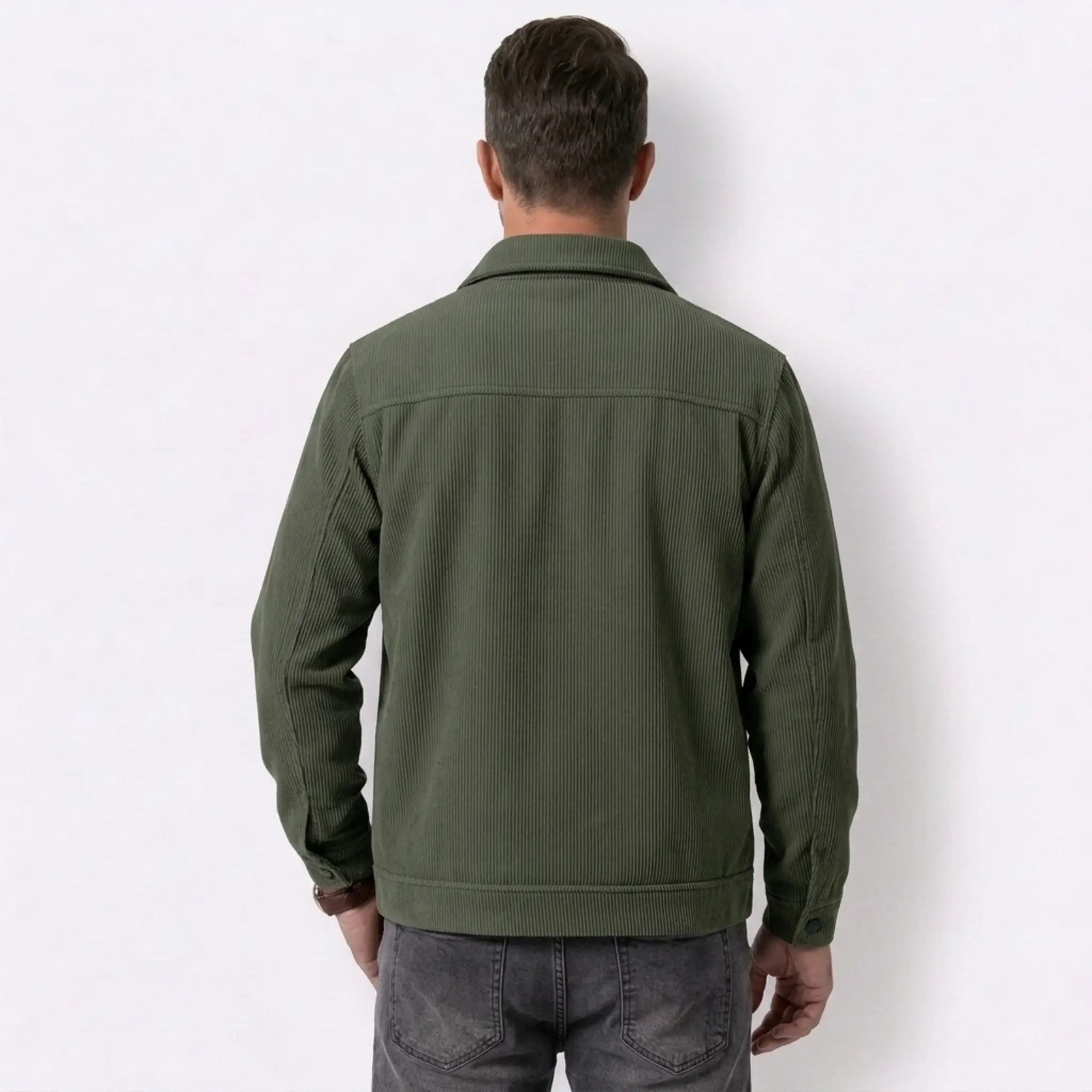 Man wearing MannerCo dark brown corduroy lapel jacket in outdoor lifestyle setting