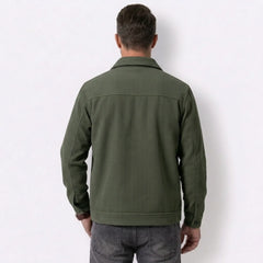 Man wearing MannerCo dark brown corduroy lapel jacket in outdoor lifestyle setting