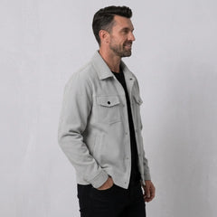 Man wearing MannerCo light gray corduroy single-breasted lapel jacket, front view on plain background