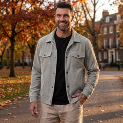 Man wearing MannerCo light gray corduroy lapel jacket in outdoor lifestyle setting