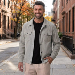 Man wearing MannerCo light gray corduroy lapel jacket in outdoor lifestyle setting