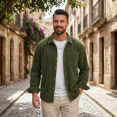 Man wearing MannerCo green corduroy long sleeve shirt in outdoor lifestyle setting