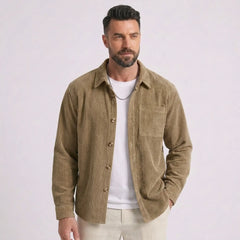 Man wearing MannerCo khaki corduroy long sleeve shirt with flip collar, front view on plain background