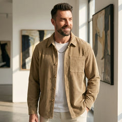 Man wearing MannerCo khaki corduroy long sleeve shirt in outdoor lifestyle setting