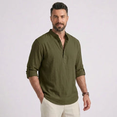 Man wearing MannerCo army green cotton linen long sleeve Henley shirt with stand collar, front view