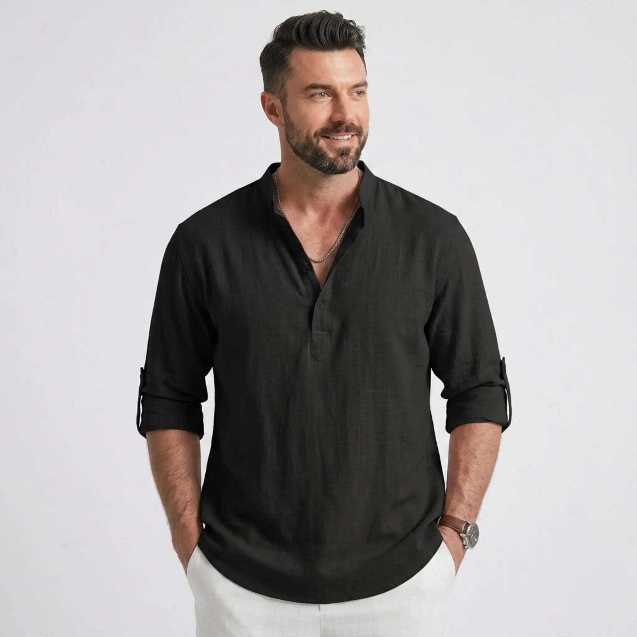 Man wearing MannerCo black cotton linen long sleeve Henley shirt with stand collar, front view
