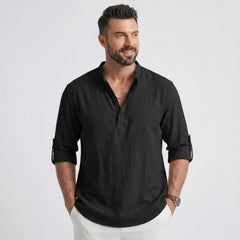 Man wearing MannerCo black cotton linen long sleeve Henley shirt with stand collar, front view