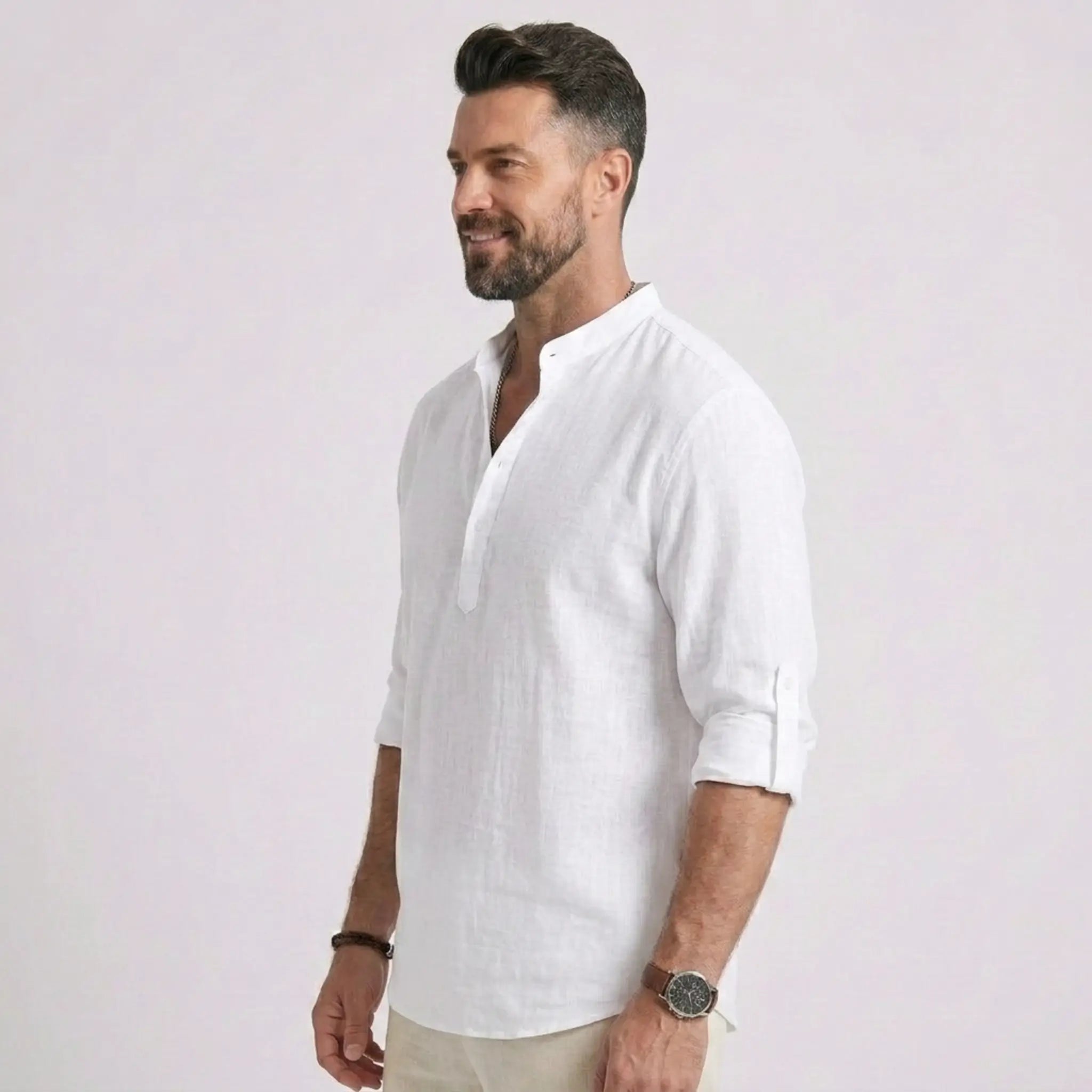 Man wearing MannerCo grey cotton linen long sleeve Henley shirt, back view on plain background