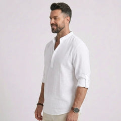 Man wearing MannerCo grey cotton linen long sleeve Henley shirt, back view on plain background