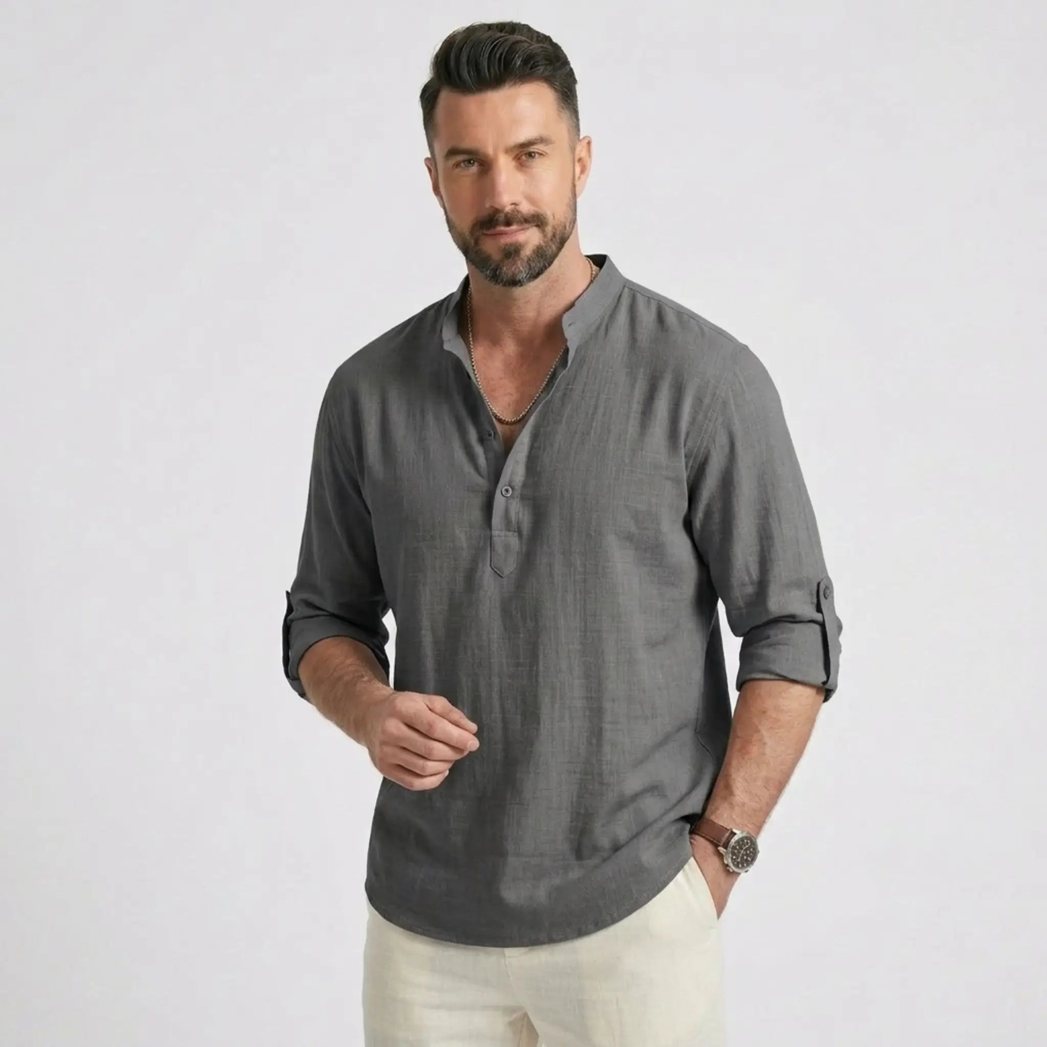 Man wearing MannerCo grey cotton linen long sleeve Henley shirt with stand collar, front view