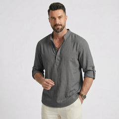 Man wearing MannerCo grey cotton linen long sleeve Henley shirt with stand collar, front view