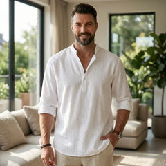 Man wearing MannerCo grey cotton linen Henley shirt in outdoor lifestyle setting