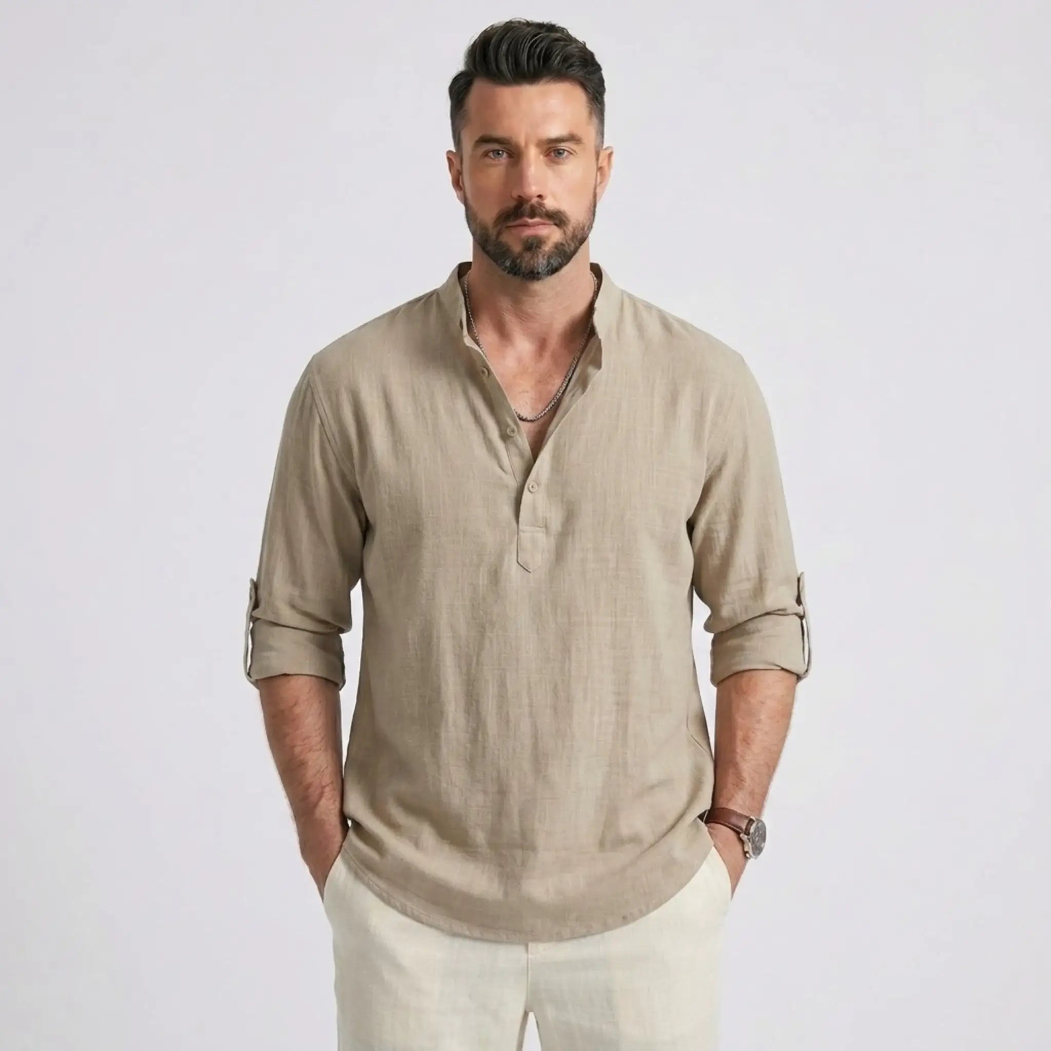 Man wearing MannerCo khaki cotton linen long sleeve Henley shirt with stand collar, front view