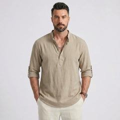 Man wearing MannerCo khaki cotton linen long sleeve Henley shirt with stand collar, front view
