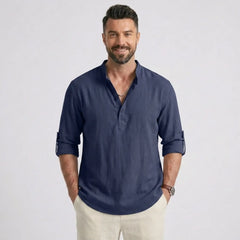 Man wearing MannerCo navy cotton linen long sleeve Henley shirt with stand collar, front view