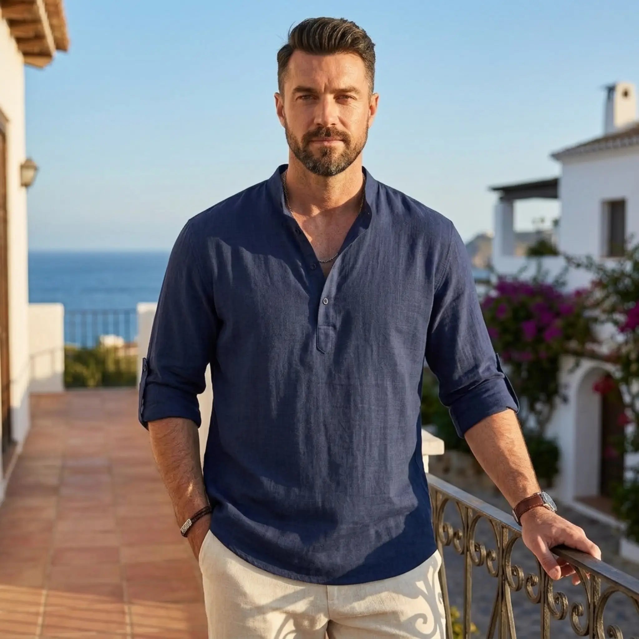 Man wearing MannerCo navy cotton linen Henley shirt in outdoor lifestyle setting