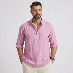 Man wearing MannerCo white cotton linen long sleeve Henley shirt with stand collar, front view
