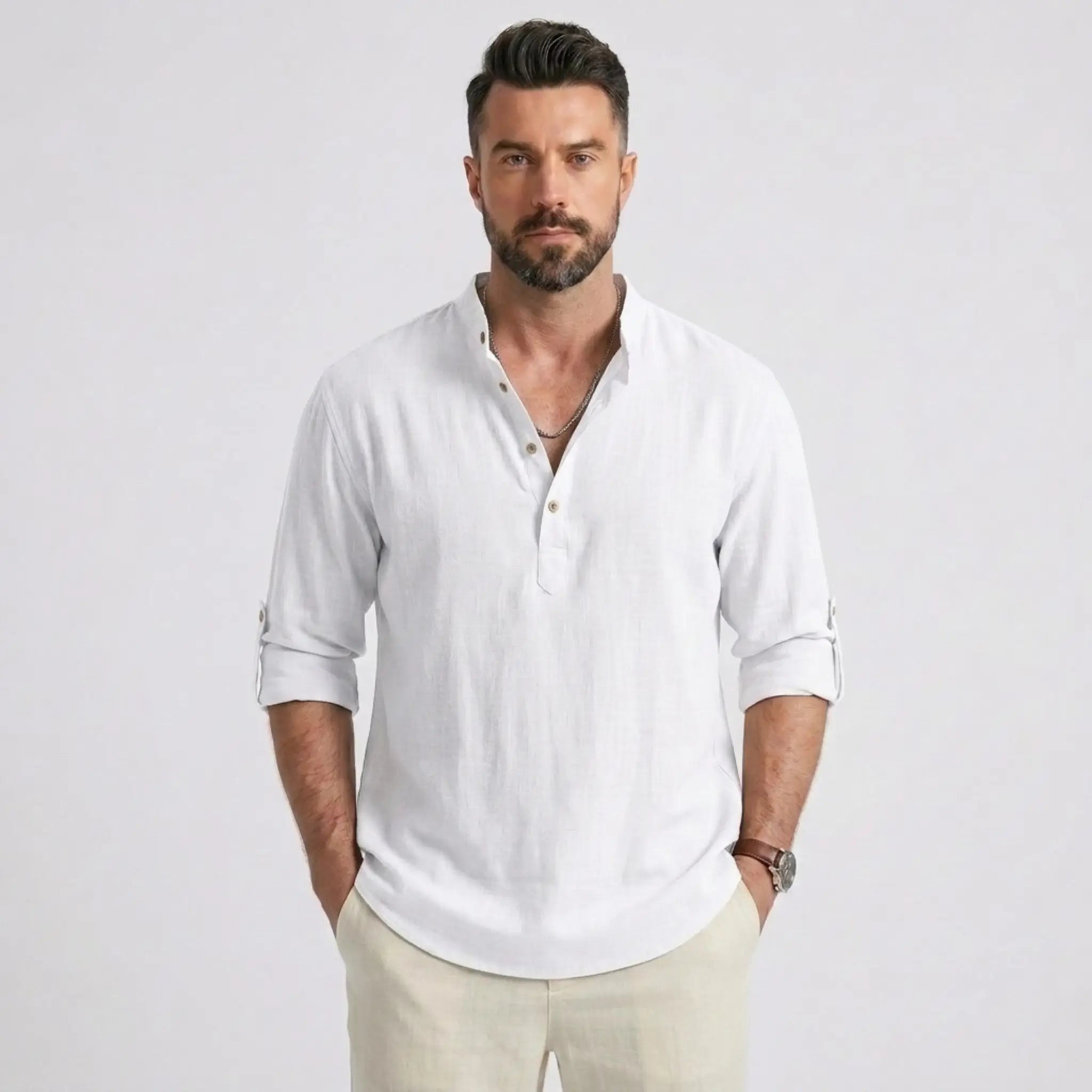 Man wearing MannerCo white cotton linen Henley shirt in outdoor lifestyle setting