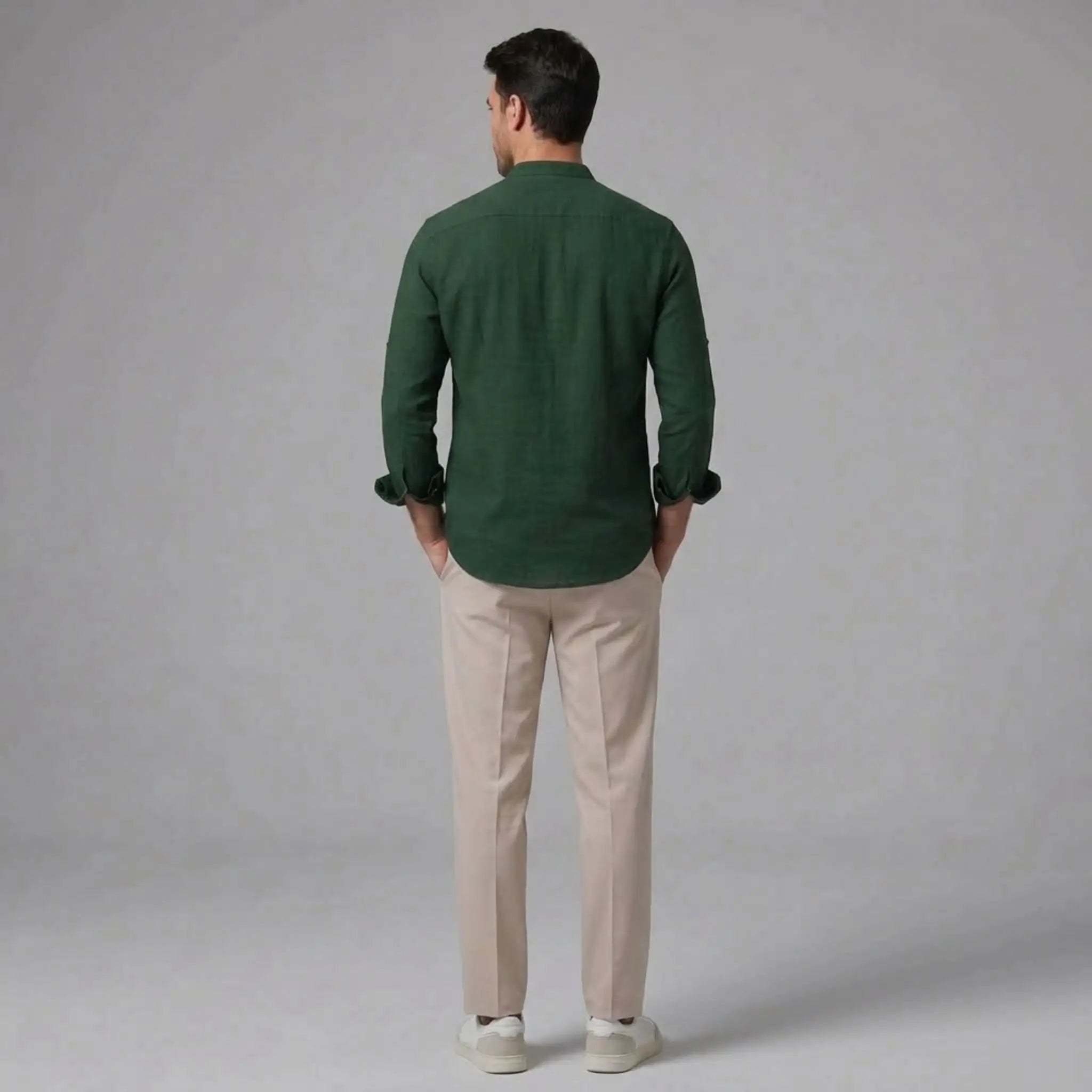 MannerCo dark green linen stand collar shirt with beige slim fit tapered trousers back view