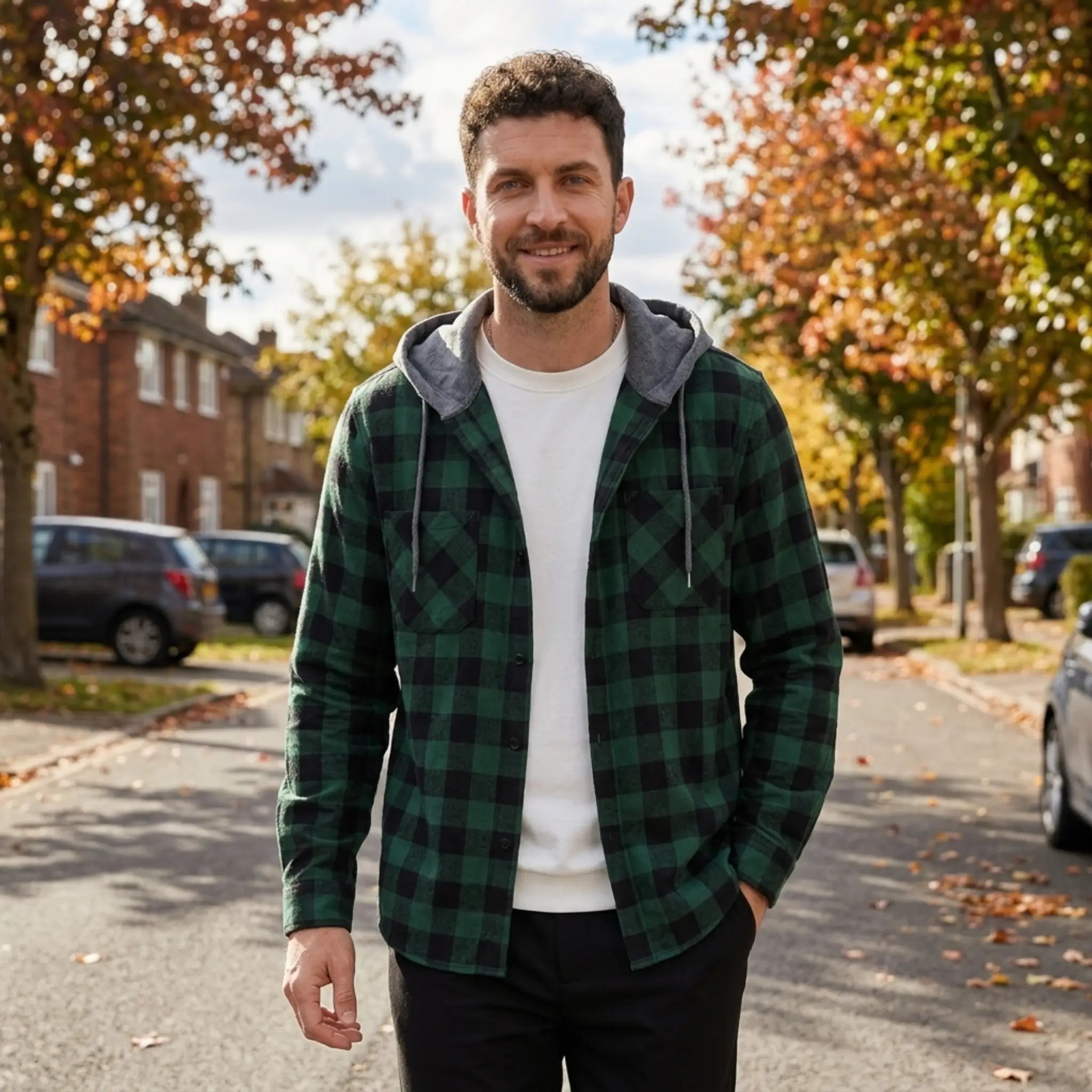 MannerCo dark green plaid hooded shirt jacket worn outdoors in autumn street setting